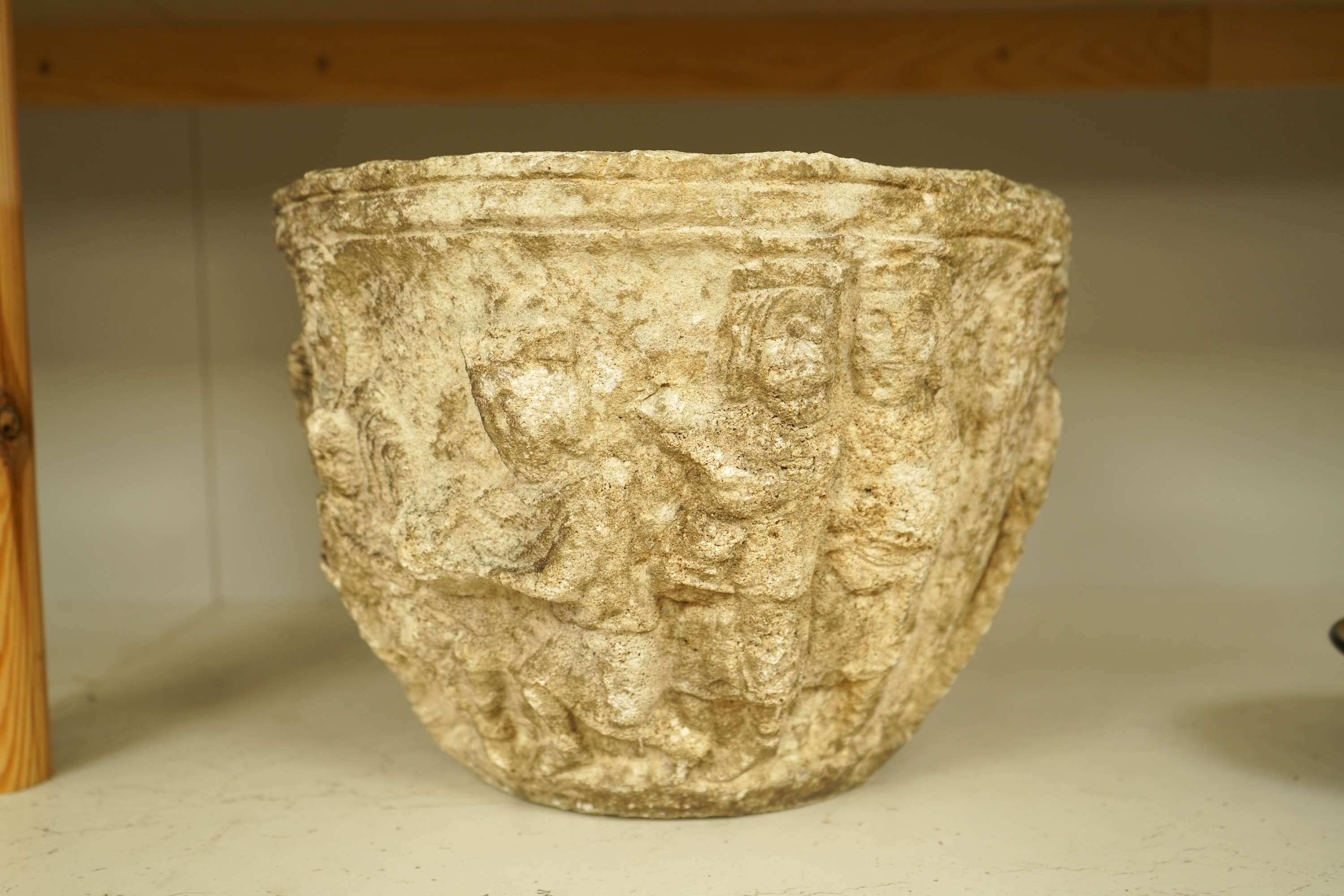 A Romanesque style reconstituted stone planter, 31cm in diameter